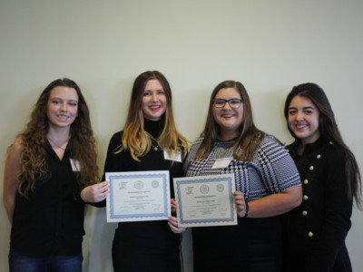 At the end of the conference, P. Swanson, T. Colbert with certificate, L. Winslow with certificate, and N. Garcia